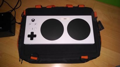 XAC Tray: An xbox adaptive controller on a trabasack mini lap tray with a velcro ready surface.