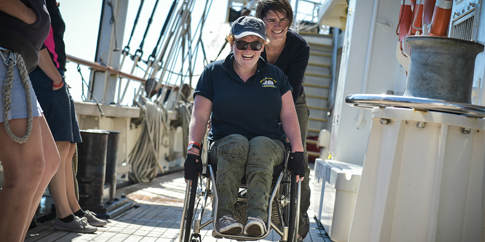 A man in a wheelchair on the Jubilee Sailing Trust's fully-accessible ship