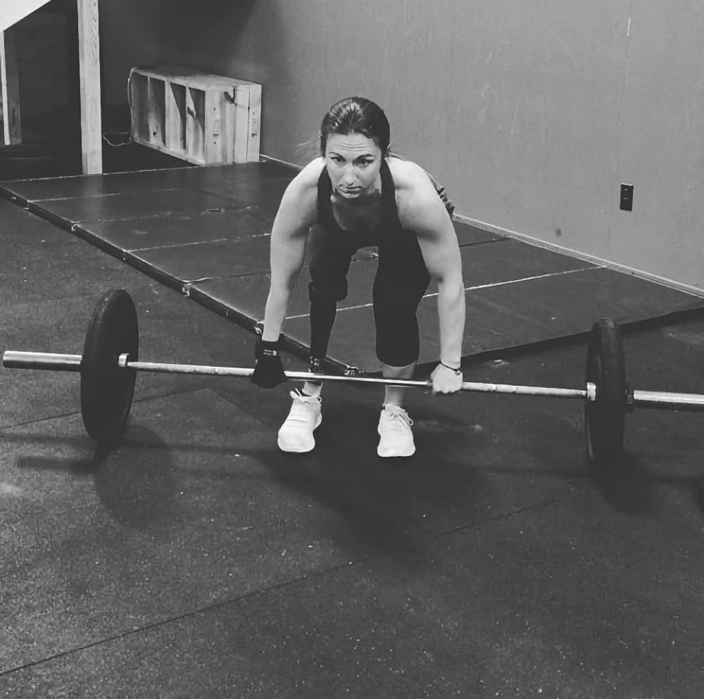 Jillian uses her General Purpose gripping aid to lift a weight bar