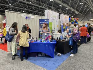 Our stand at AOTA where Clare, Jo and Rob are talking to OTs about our products