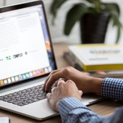 Working on a laptop in an office