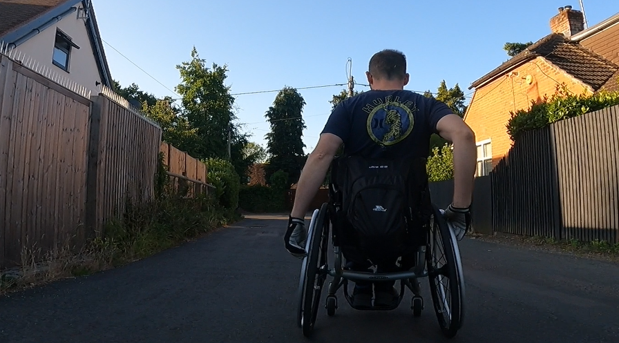 Wheelchair User Propelling Independently.