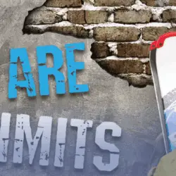 Smiling skier in a helmet and goggles holds skis beside large text on a brick wall that reads: “There Are No Limits.”