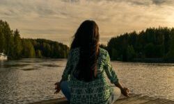 woman on a pier mediating